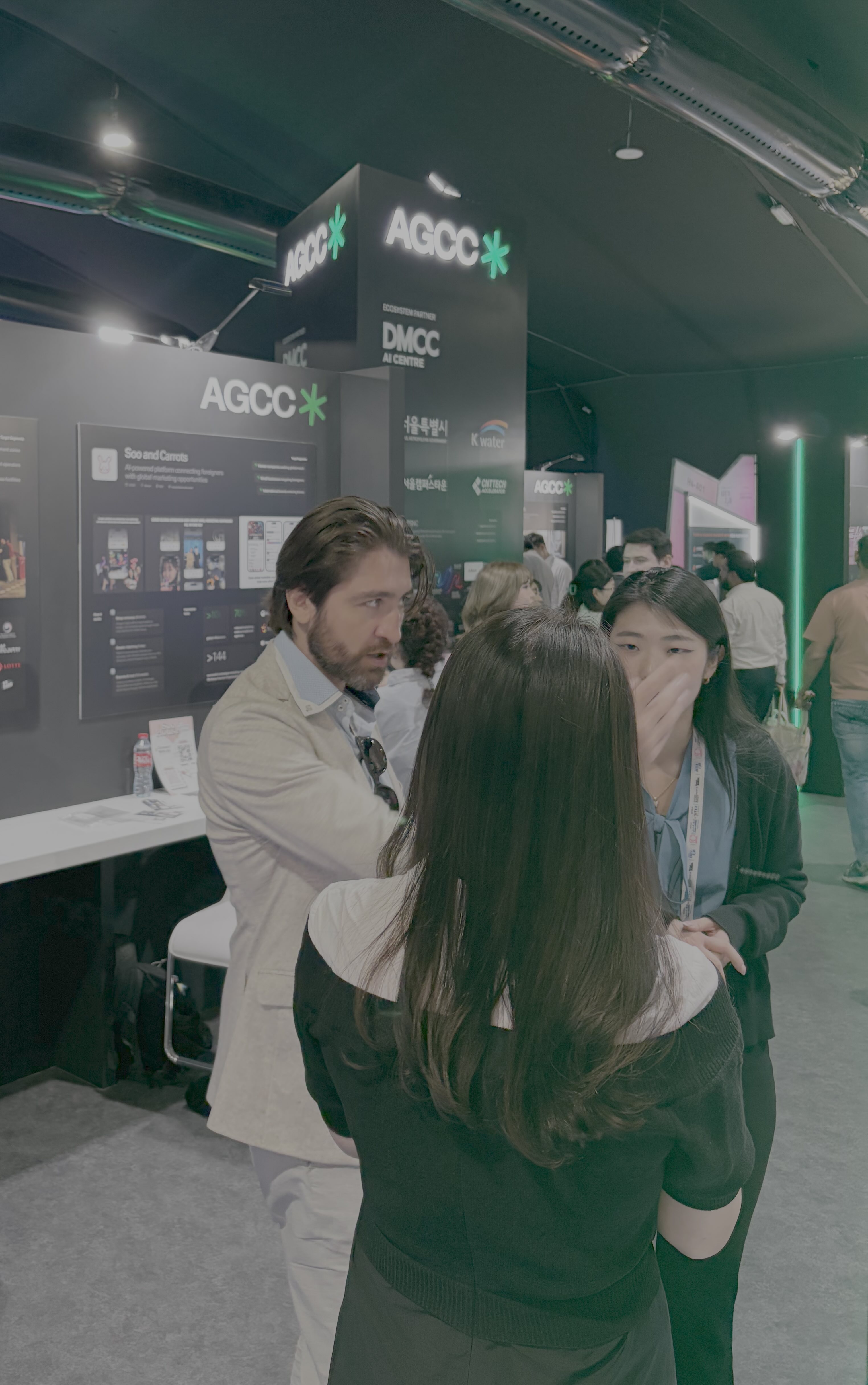 Representative from Mirajet startup standing beside their equipment at the AGCC booth during Expand North Star 2024, showcasing innovative technology.