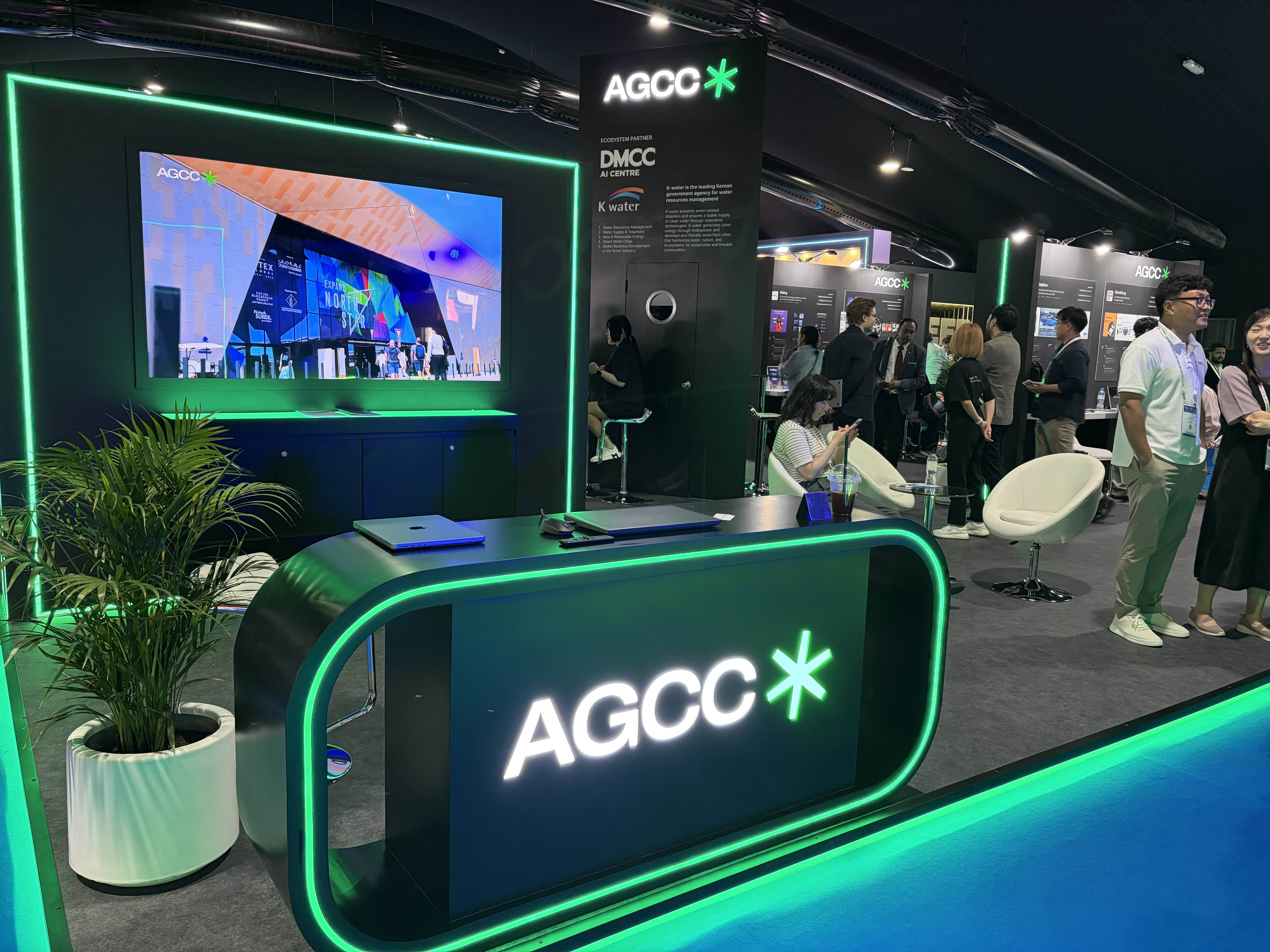 AGCC booth at Expand North Star 2024, with Managing Partner Han Gust and Chiara de Caro discussing with visitors.