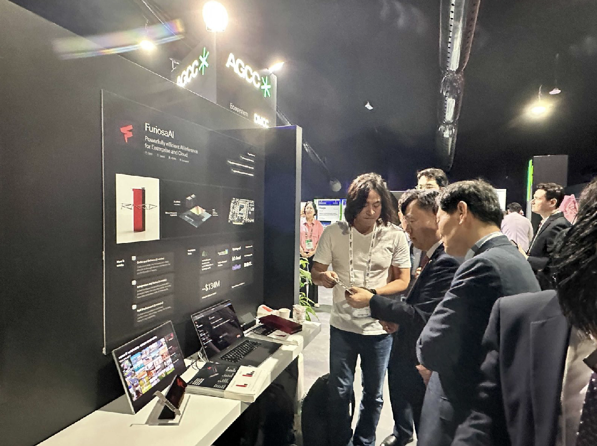 June Paik, CEO of Furiosa AI, presenting AI solutions to H.E. Mr. Dohyun Kang, Vice Minister of Science and ICT from Korea, at the AGCC booth at Expand North Star 2024.