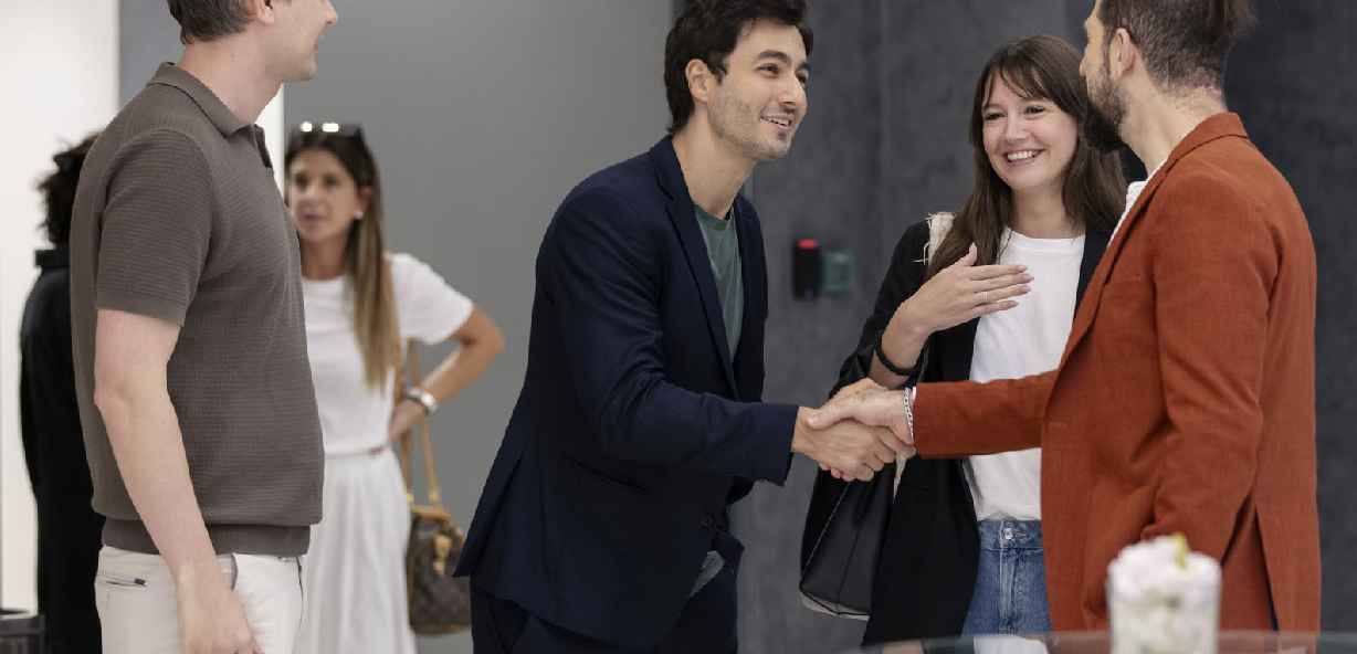 Participants exchanging a handshake during a networking session at AGCC Business Forum 2024, fostering Korea-UAE connections.