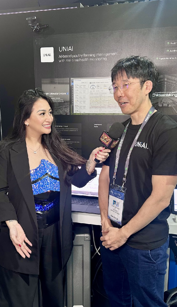 Cofounder of UniAI discussing AI-based poultry farming solutions in an interview at the AGCC booth during Expand North Star 2024.